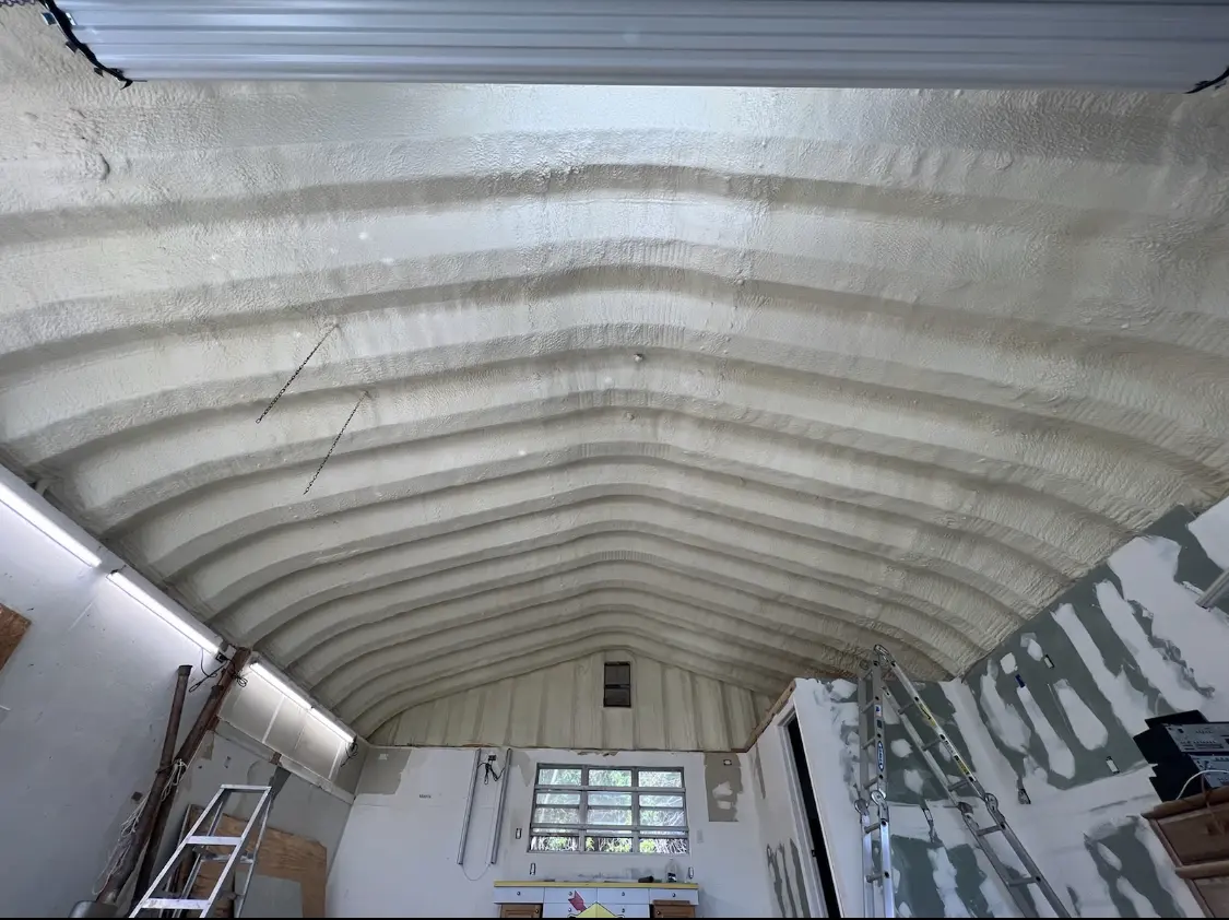 Spray polyurethane foam applied to the underside of a metal roof deck in Goldsboro