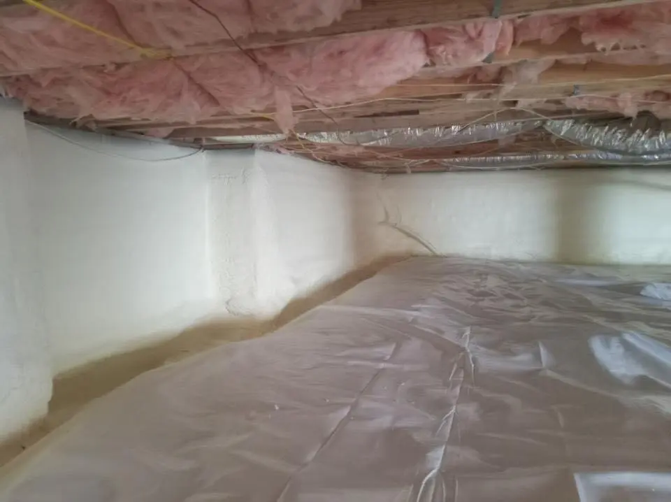 Crawl space encapsulation with closed-cell spray foam for Commercial Roof Restoration in Goldsboro